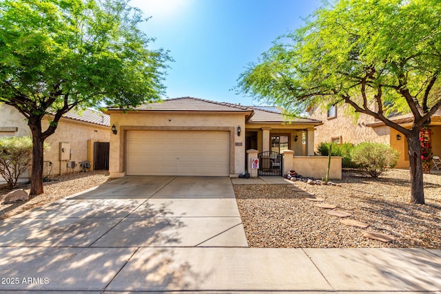 152 N 194th Ln, Buckeye, AZ 85326 - ranch-style home with a tiled roof, stucco siding, a gate, a garage, and driveway