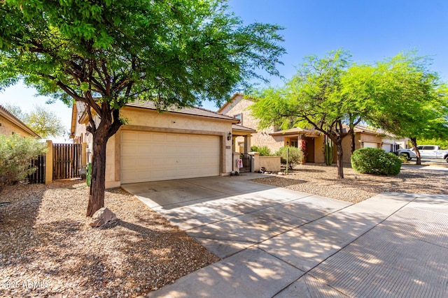 152 N 194th Ln, Buckeye, AZ 85326 - view of front of house with stucco siding, driveway, an attached garage, a tile roof, and fence