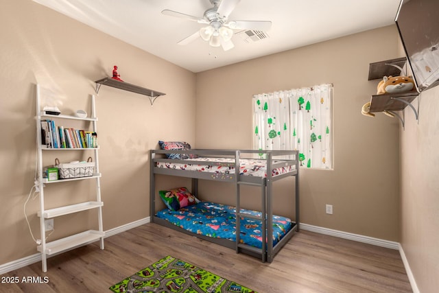 152 N 194th Ln, Buckeye, AZ 85326 - bedroom featuring visible vents, baseboards, a ceiling fan, and wood finished floors