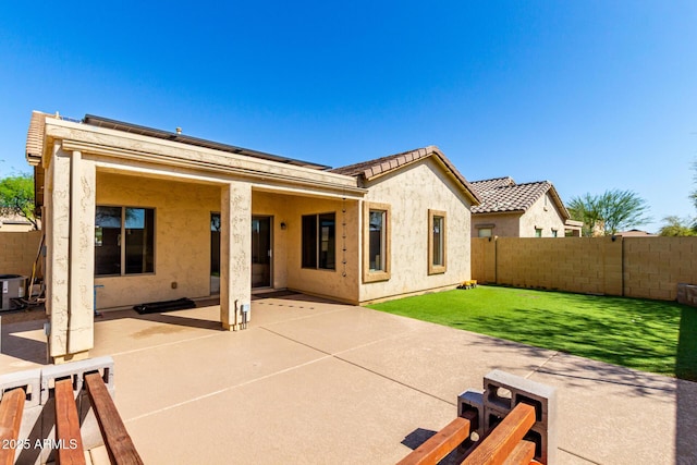 152 N 194th Ln, Buckeye, AZ 85326 - rear view of house with a yard, a fenced backyard, a patio, central air condition unit, and stucco siding