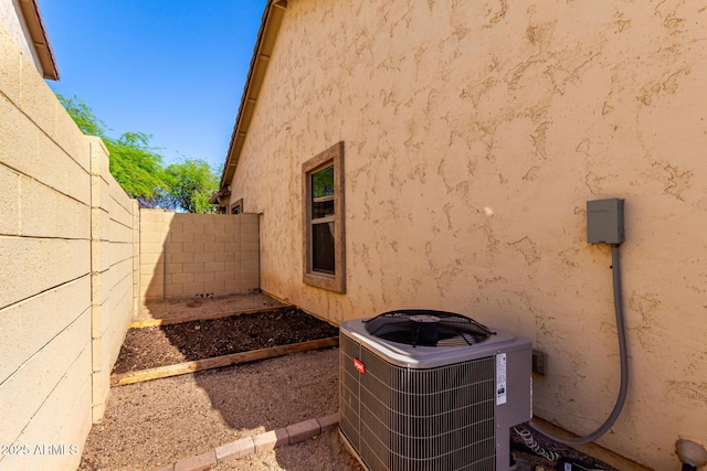 152 N 194th Ln, Buckeye, AZ 85326 - view of home's exterior with central air condition unit, a fenced backyard, and stucco siding