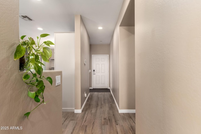 152 N 194th Ln, Buckeye, AZ 85326 - hall with wood finished floors, baseboards, visible vents, and recessed lighting
