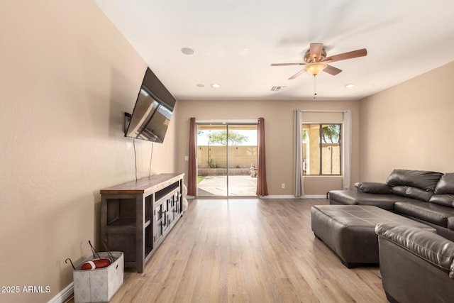 152 N 194th Ln, Buckeye, AZ 85326 - living area featuring visible vents, baseboards, light wood-type flooring, a ceiling fan, and recessed lighting