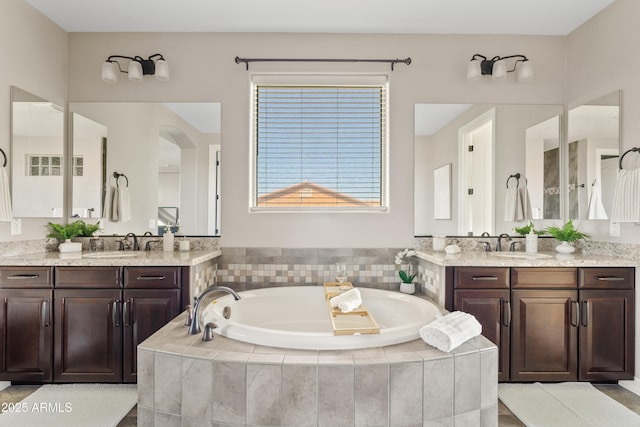 10331 E Starion Ave, Mesa, AZ 85212 - bathroom with two vanities and a bath