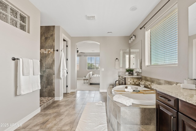 10331 E Starion Ave, Mesa, AZ 85212 - full bathroom with a garden tub, connected bathroom, vanity, a walk in shower, and tile patterned flooring