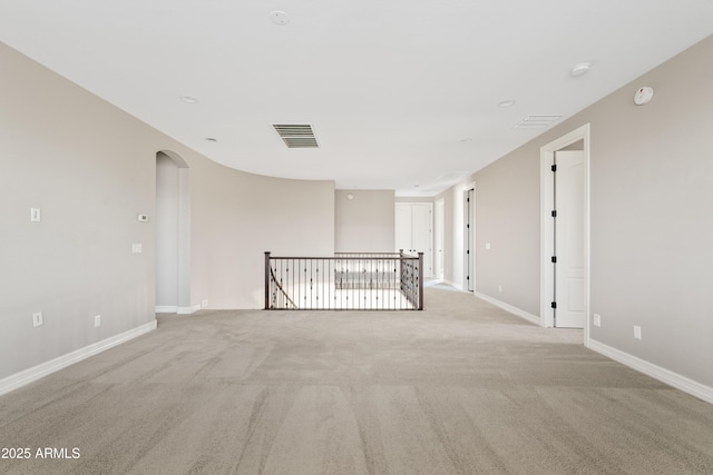 10331 E Starion Ave, Mesa, AZ 85212 - spare room featuring arched walkways, light colored carpet, and a smoke detector