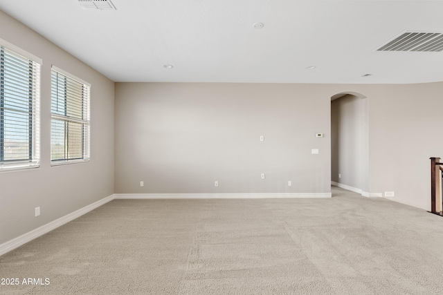 10331 E Starion Ave, Mesa, AZ 85212 - spare room featuring arched walkways, light colored carpet, and recessed lighting