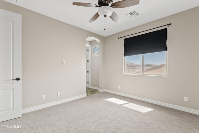 10331 E Starion Ave, Mesa, AZ 85212 - unfurnished room featuring arched walkways, carpet floors, and ceiling fan
