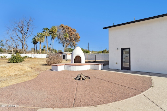 view of patio / terrace featuring exterior fireplace