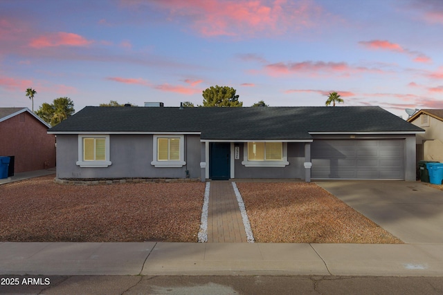 single story home with a garage