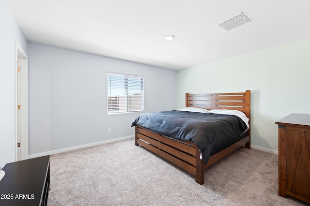 bedroom with light carpet