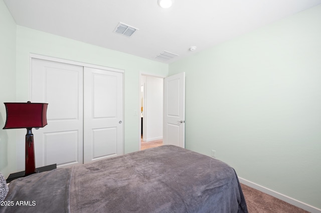 carpeted bedroom featuring a closet