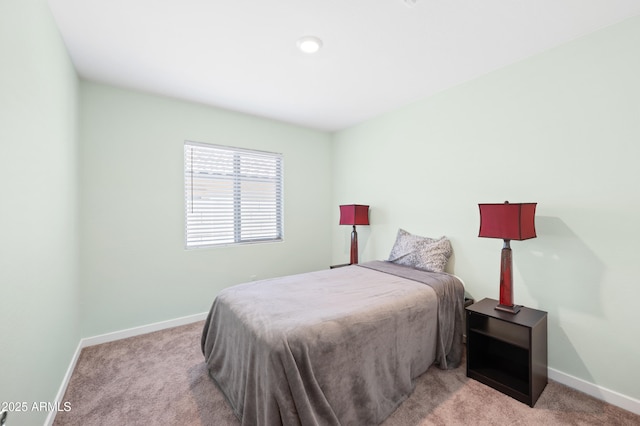 bedroom with light carpet