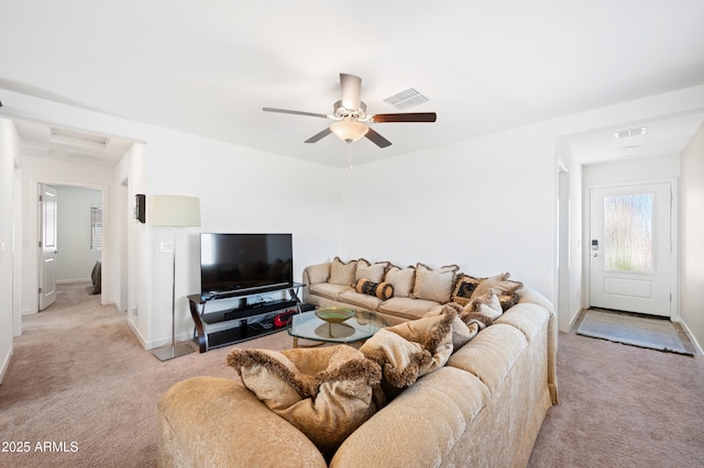 carpeted living room featuring ceiling fan