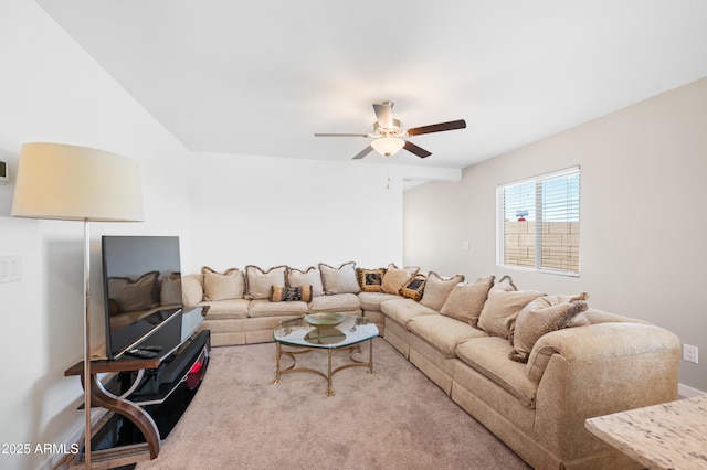 carpeted living room featuring ceiling fan