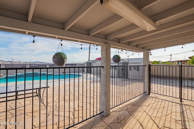 view of patio / terrace with a fenced in pool and fence