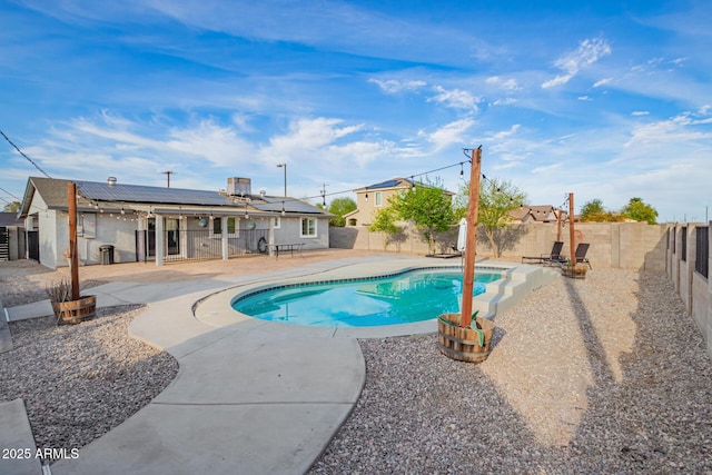 view of pool featuring a fenced backyard, a fenced in pool, and a patio area
