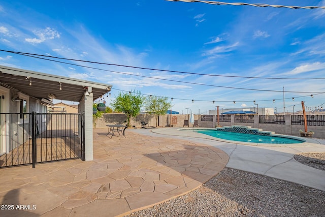 view of swimming pool featuring a fenced backyard, a patio, and a fenced in pool