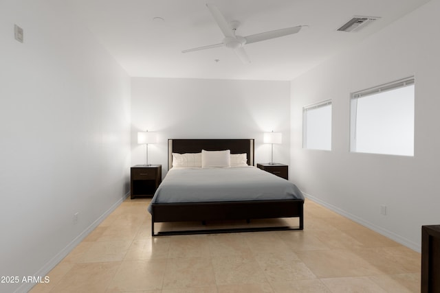 bedroom with ceiling fan and light tile patterned floors