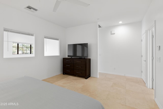 tiled bedroom with ceiling fan