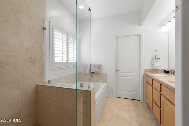 bathroom featuring tile patterned flooring, vanity, and separate shower and tub