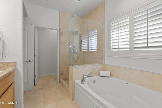 bathroom featuring vanity, tile patterned floors, and separate shower and tub