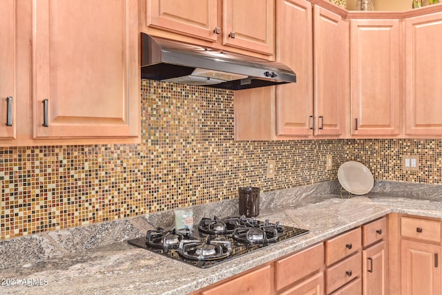 kitchen with black gas cooktop and backsplash