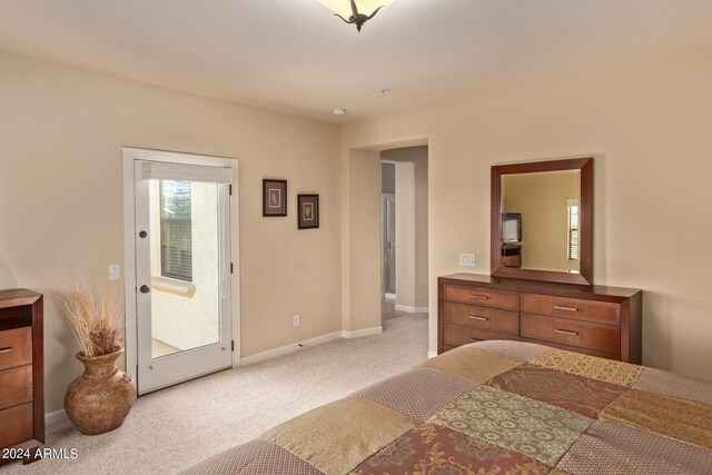 carpeted bedroom featuring access to outside