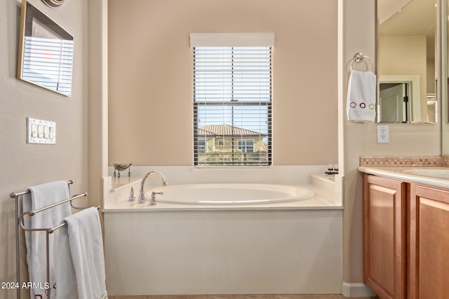 bathroom with a bath and vanity