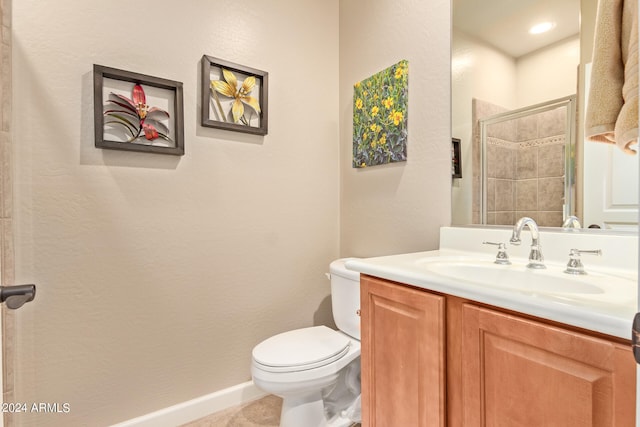 bathroom with toilet, tile floors, and large vanity