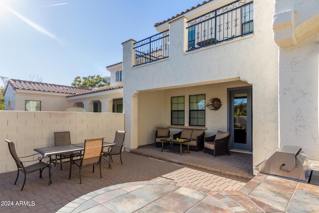 view of terrace featuring outdoor lounge area and a balcony