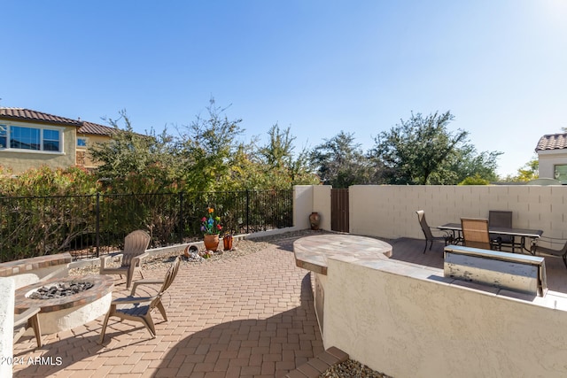 view of patio / terrace with a fire pit