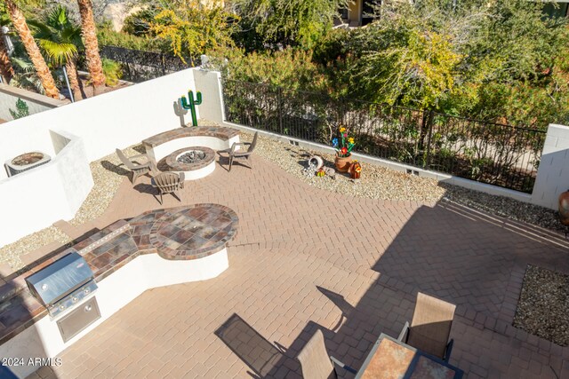 view of patio with a fire pit