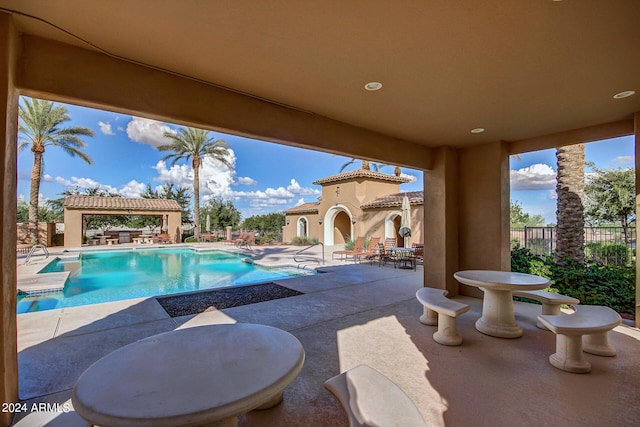 view of pool featuring a patio area