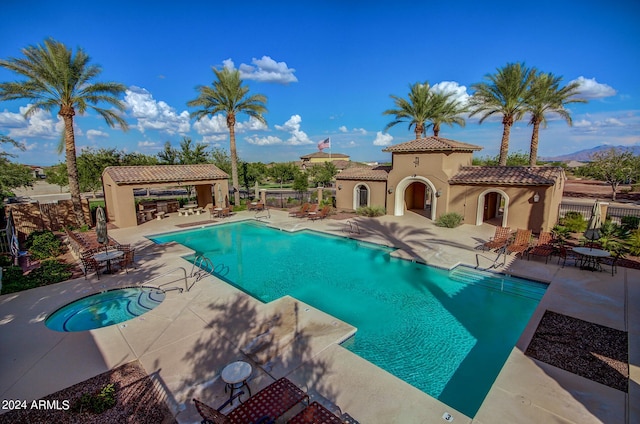 view of swimming pool with a patio area