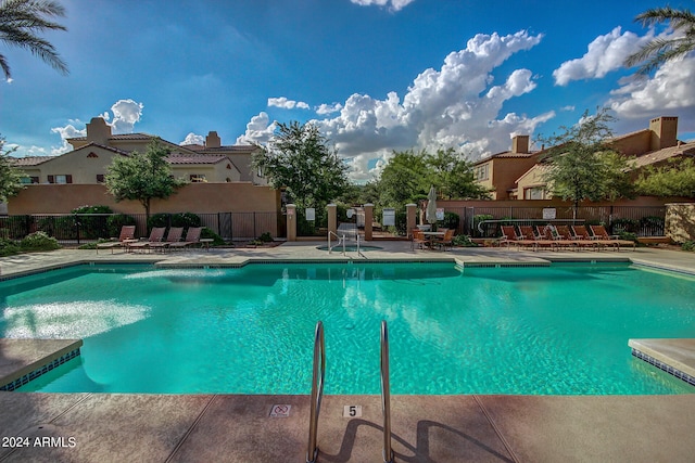 view of swimming pool with a patio