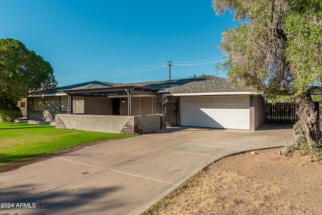 ranch-style house featuring stucco siding, fence, concrete driveway, a front yard, and a garage