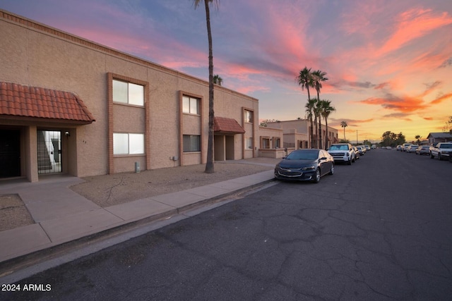 view of outdoor building at dusk