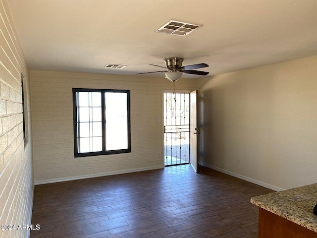 925 E Henry St, Tempe, AZ 85288 - spare room with baseboards, a ceiling fan, and dark wood-style floors