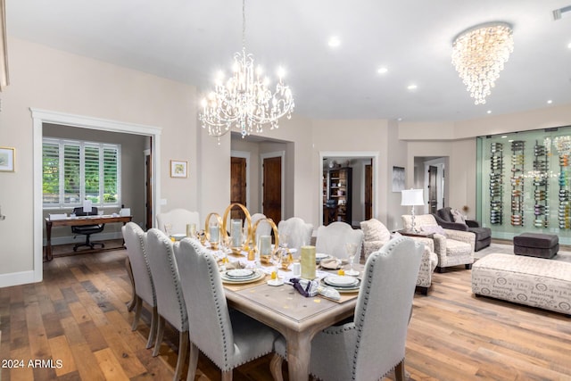 dining space with a notable chandelier and wood-type flooring