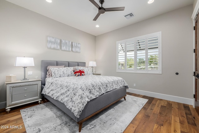 bedroom featuring ceiling fan and dark wood-type flooring