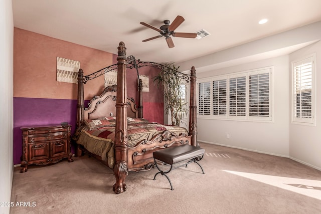 bedroom with ceiling fan and light carpet