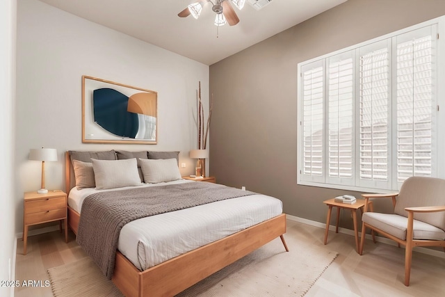 bedroom with lofted ceiling and ceiling fan