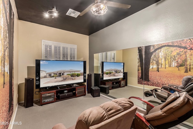 carpeted cinema featuring ceiling fan