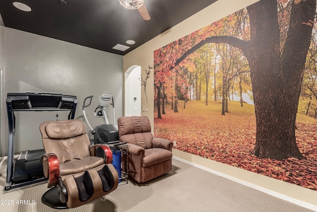 sitting room featuring ceiling fan