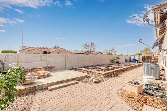 view of patio with central AC unit