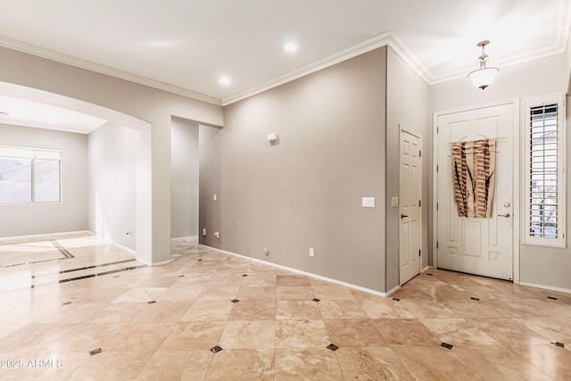 entryway featuring crown molding