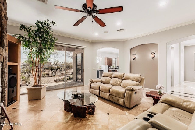 living room featuring ornamental molding and ceiling fan