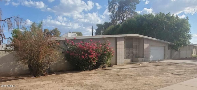 exterior space featuring concrete driveway