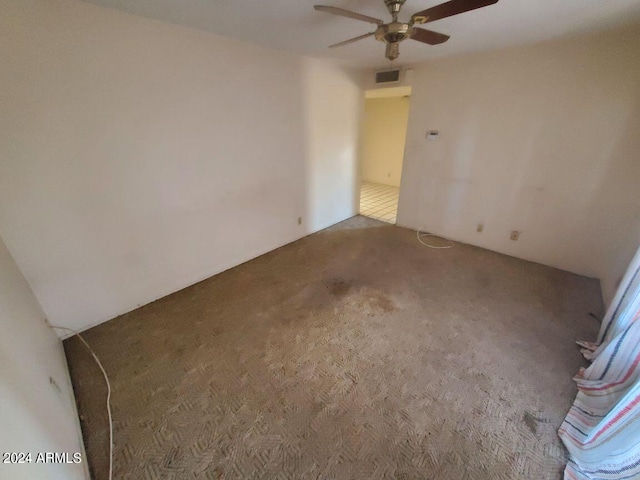 unfurnished room with carpet floors and ceiling fan